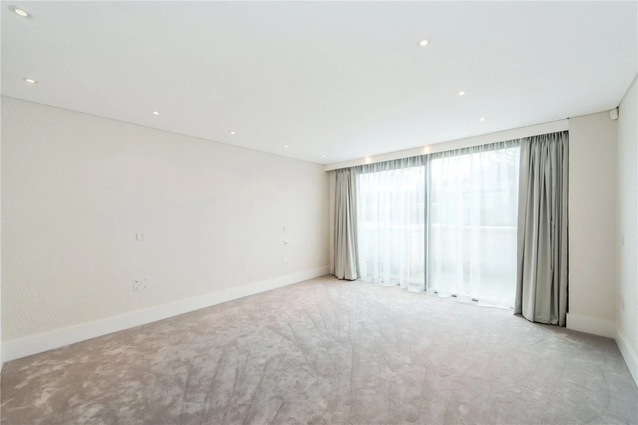 St John's Wood apartment bedroom with full-height curtains
