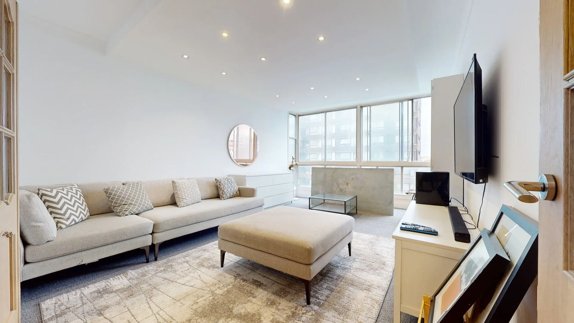 Hyde Park apartment reception with a sofa and ottoman