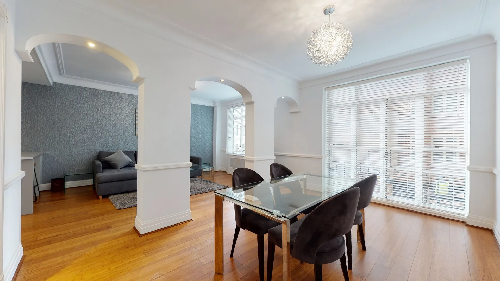Mayfair apartment dining area beneath a crystal chandelier
