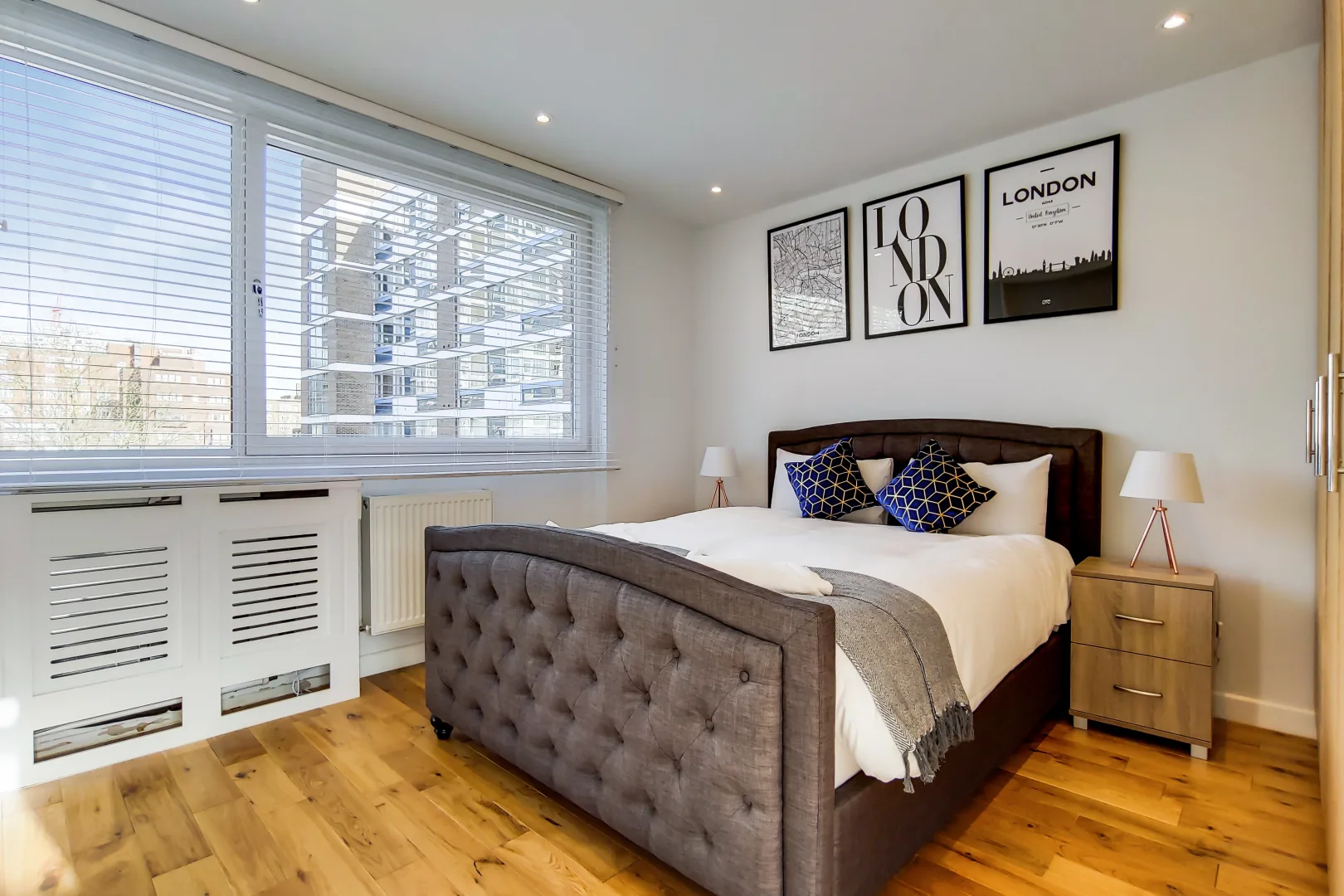 Hyde Park house principal bedroom with a tufted headboard