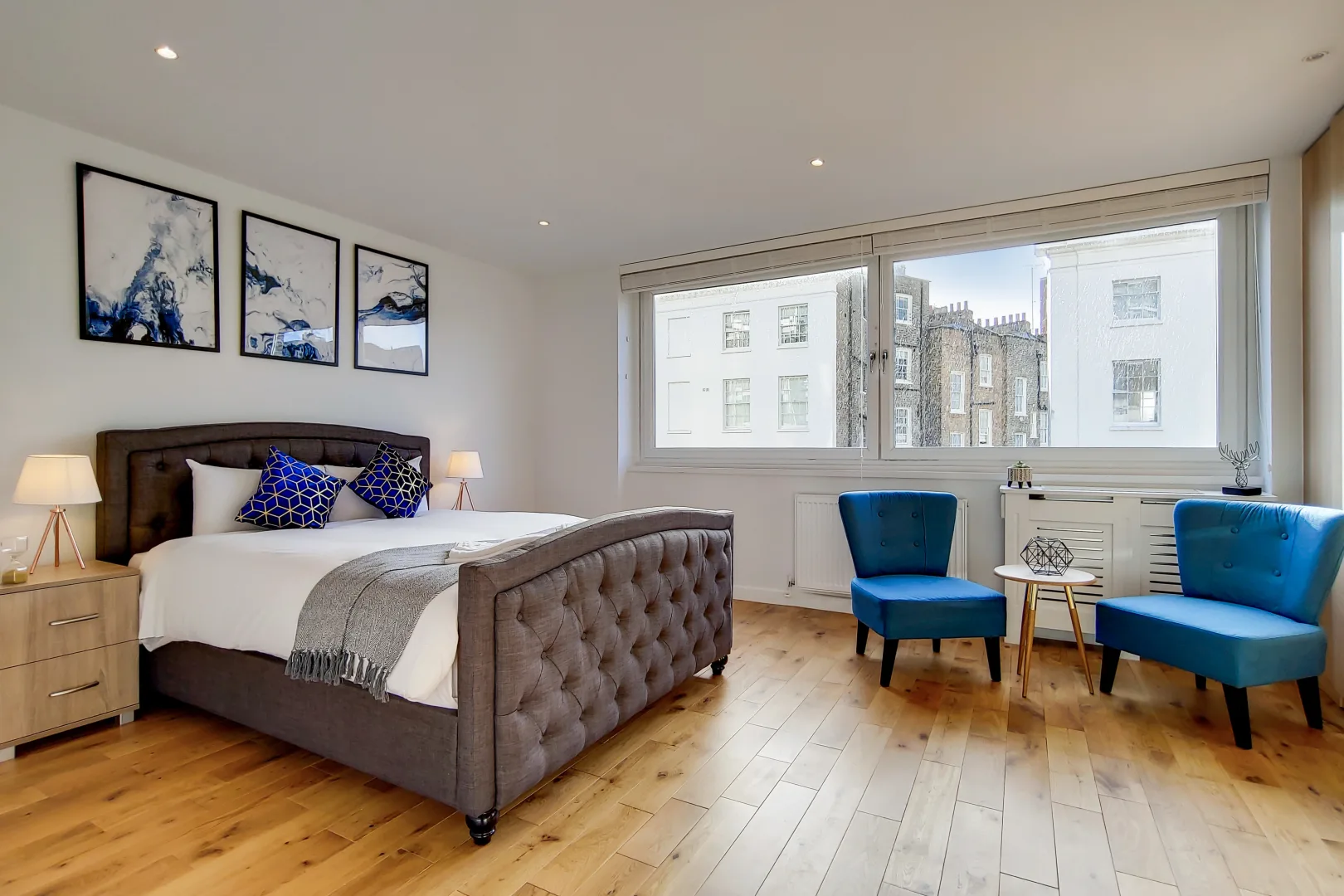 Hyde Park house third bedroom with armchairs by the window
