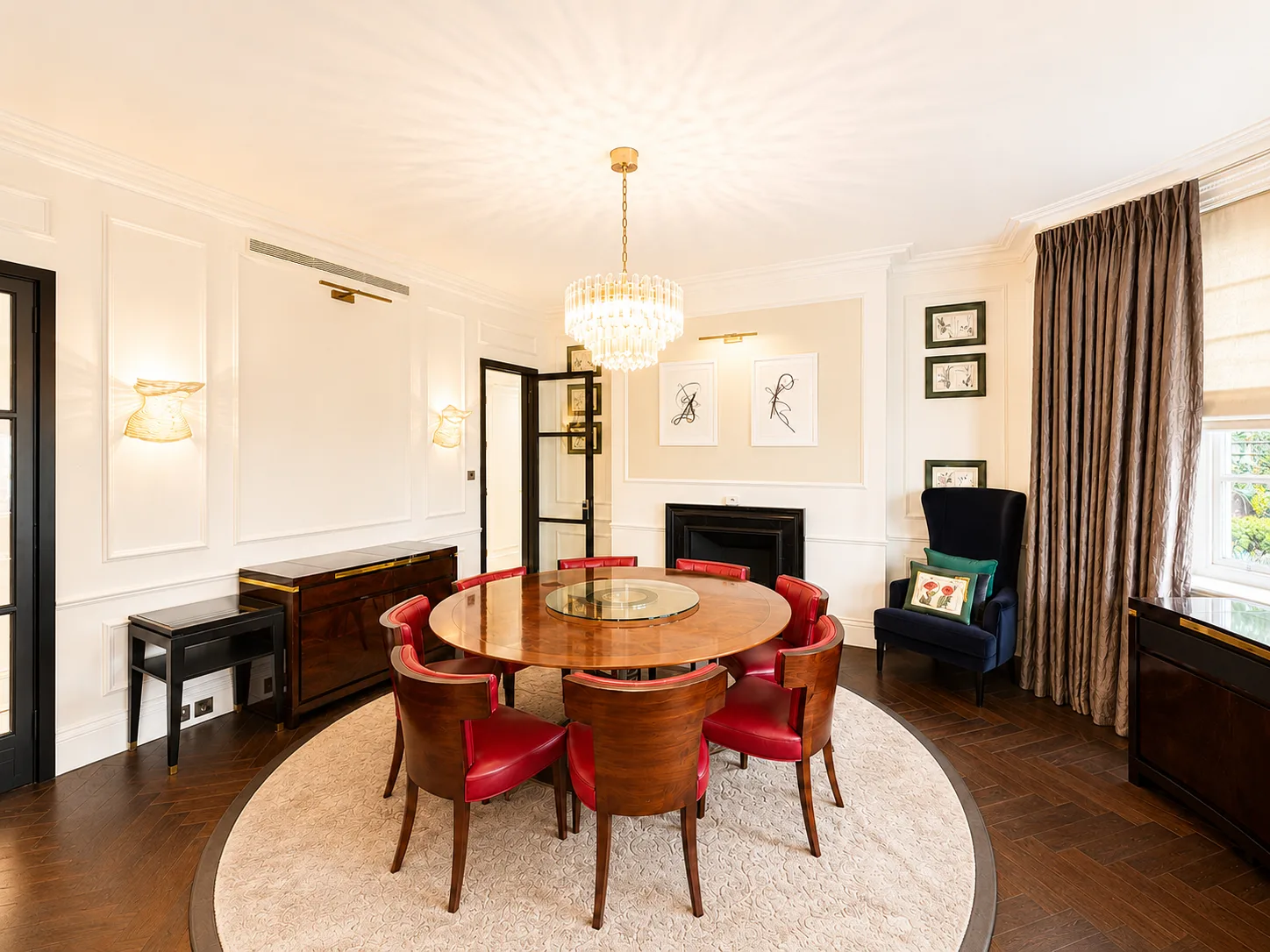 Mayfair apartment dining room with a round table beneath a chandelier