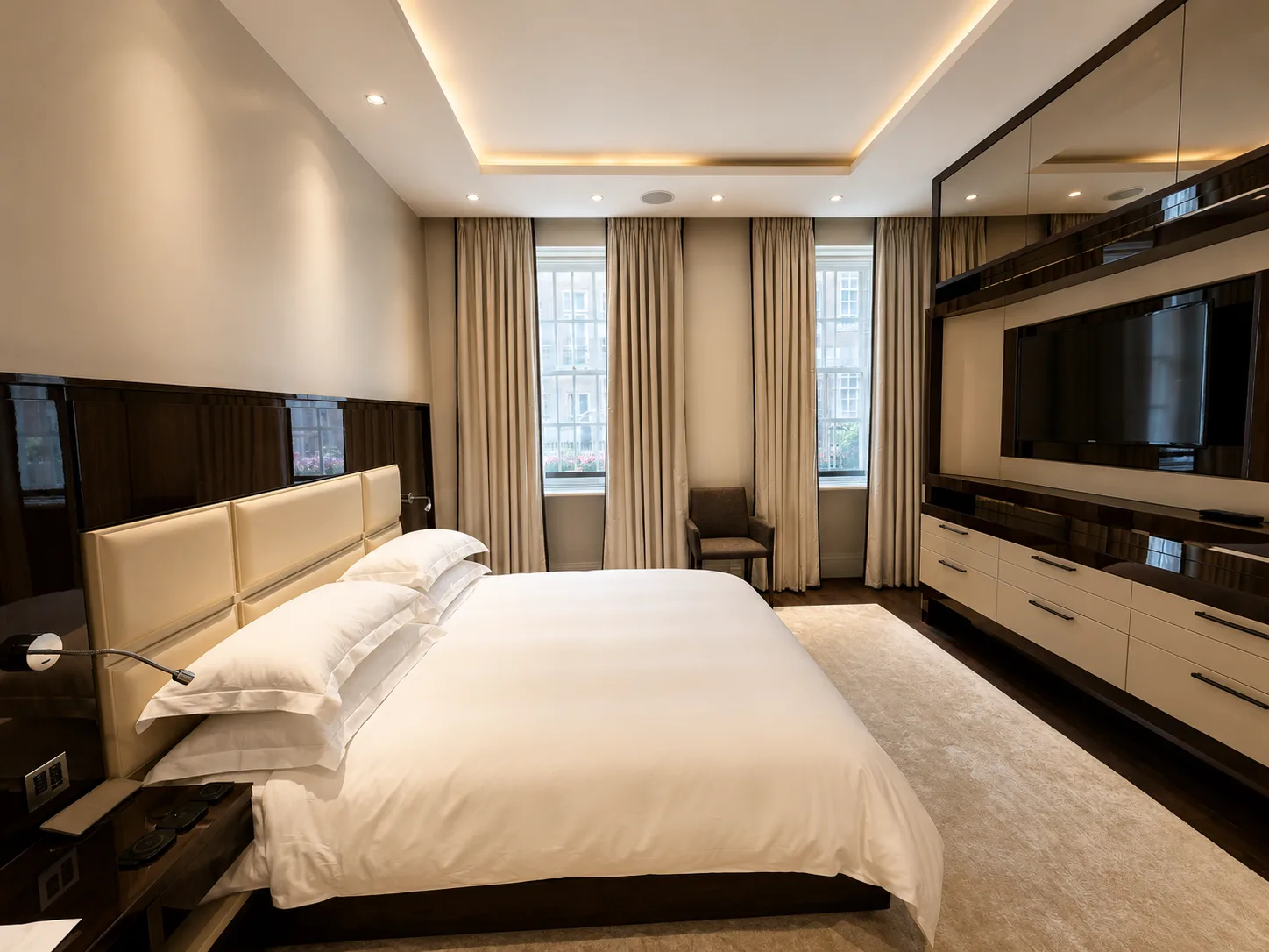 Mayfair apartment principal bedroom with a panelled headboard
