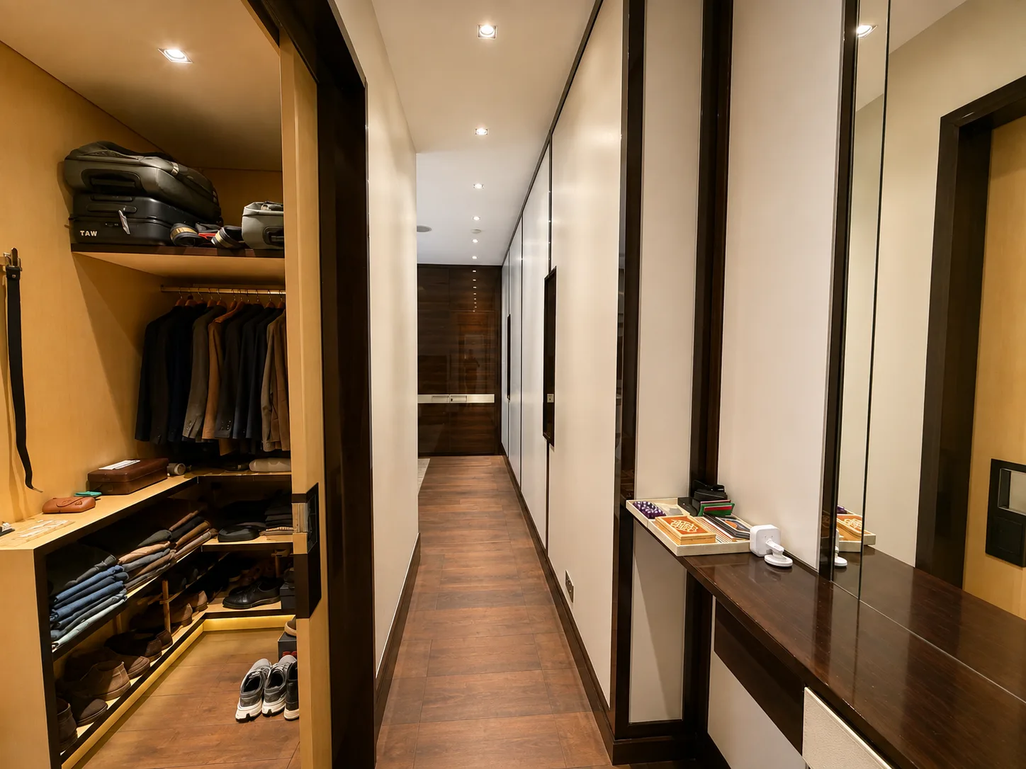 Mayfair apartment walk-in dressing room with lit shelving