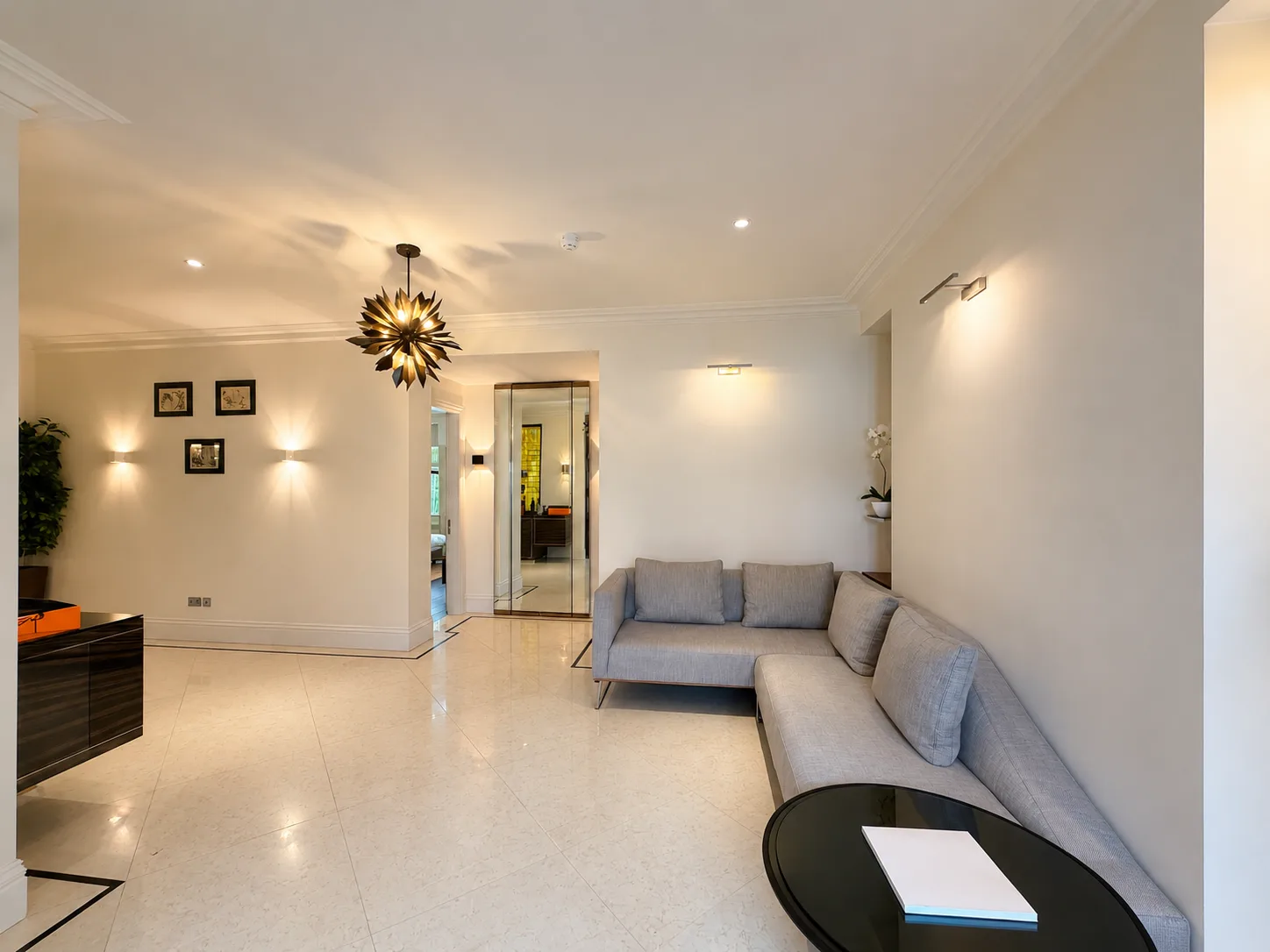 Mayfair apartment entrance hall with polished stone floors